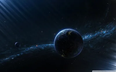 Light rays rake in from the upper left across a mostly dark planet, a faint galaxy band and a small moon keeping the whole scene deep blue.