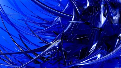 Sheets of cobalt glass crease and fold across the frame, white highlights tracing every sharp edge and spike.