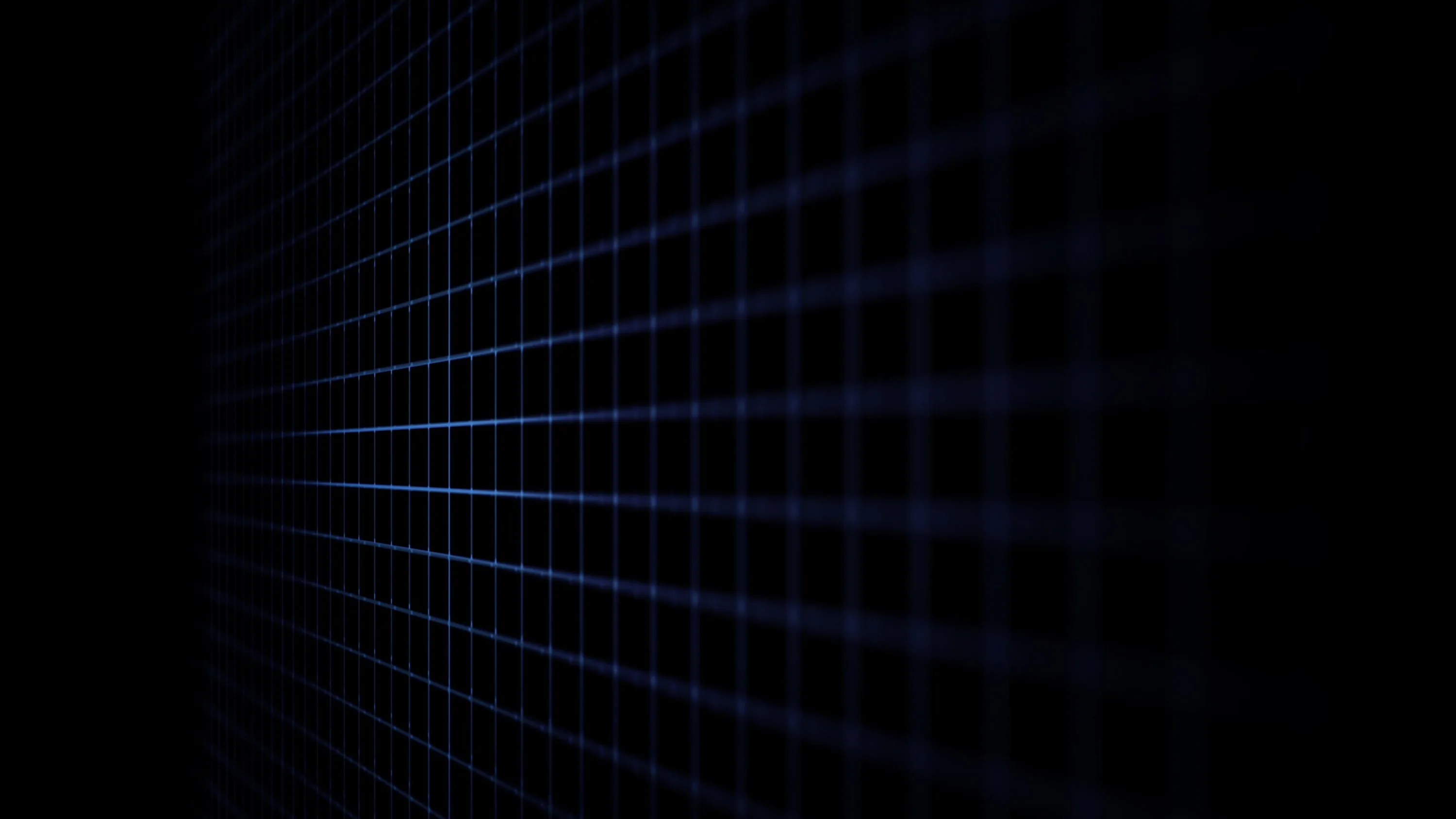 A wireframe grid runs off at a steep angle, its blue lines dimming until the right side of the frame is empty black.