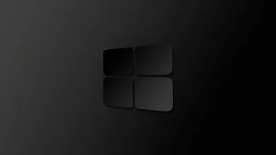 The four panes are raised slightly out of a dark grey field, readable only by the shadow along their edges.