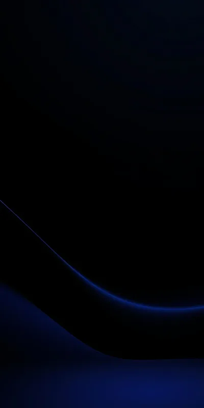 Almost the entire frame is black, broken only by a soft blue arc sweeping along the bottom and a dim glow at the very base.