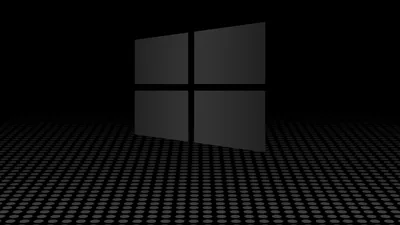 The window mark tilts in 3D above a floor of fine white dots, matte black on black with only its edges catching a rim of grey.