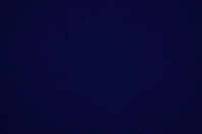 A flat, unbroken field of deep navy with the faintest lift toward the centre — plain enough to sit behind icons or text anywhere on screen.