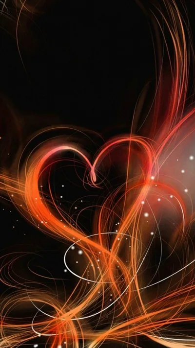 Ribbons of orange and red light curl upward and cross into a heart, small white sparks scattered through the surrounding black.