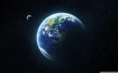The cloud-marbled globe sits left of centre with its small grey moon at the upper left, fine stars dusting an otherwise black frame.