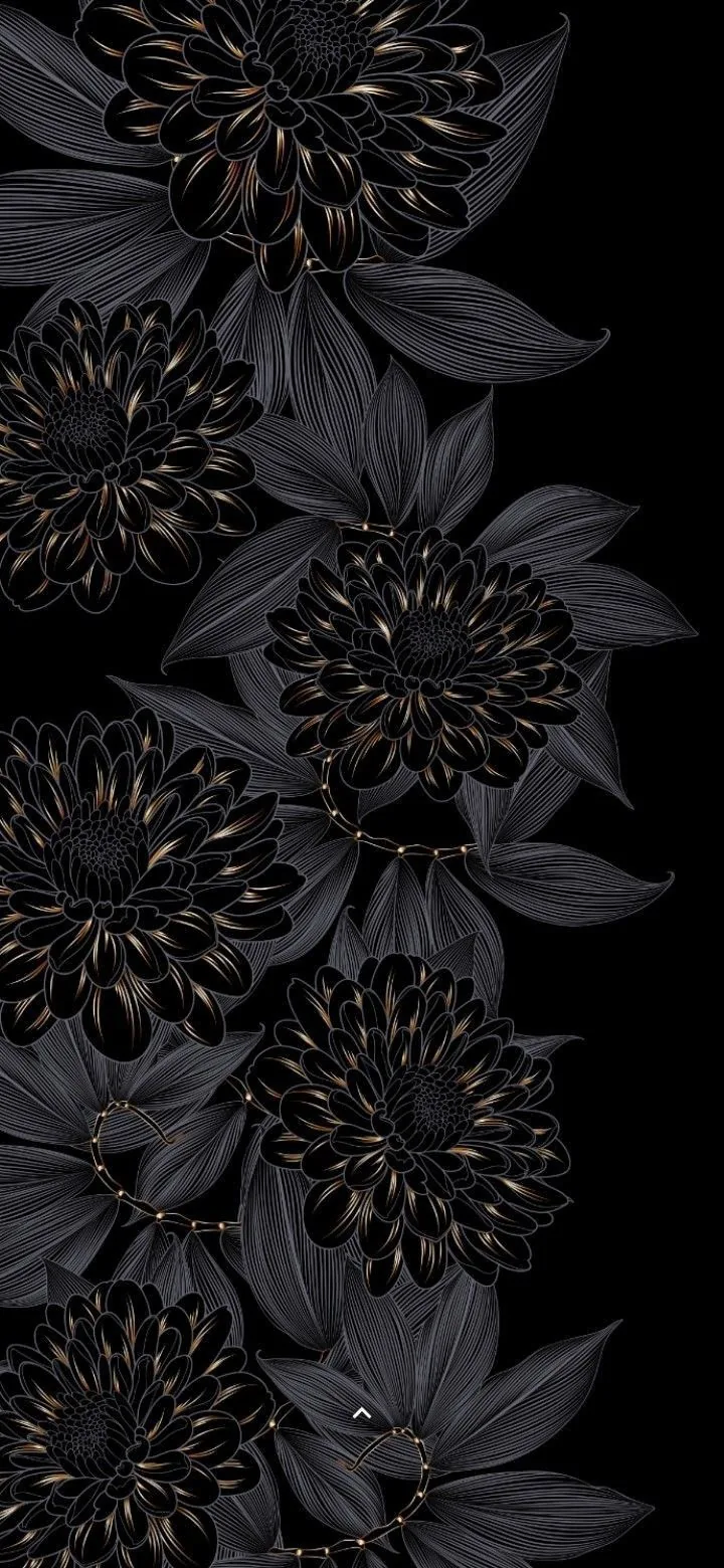 Carved black dahlias and leaves run up the left side of a tall frame, faint gold tracing the petal edges while the right half stays pure black.