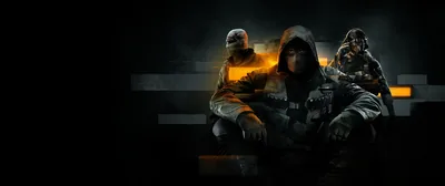 Three masked figures sit on a bench in near darkness, one lit by a small orange flame in an ultrawide frame.