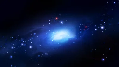 A soft blue glow spreads from the centre of this nebula, ringed by scattered stars, with a couple of faint orange points above the core.