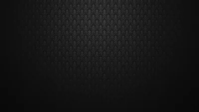 A small fleur-de-lis motif tiles across the upper half in dark grey, the bottom third left as plain black where the light drops off.