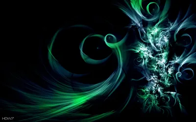 Green and teal filaments coil across the frame, breaking into fine sparks along the right side.