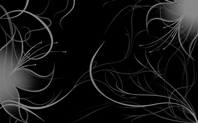 Fine curling filaments sweep in from the left and right, tipped with tiny bright points against a dark ground.