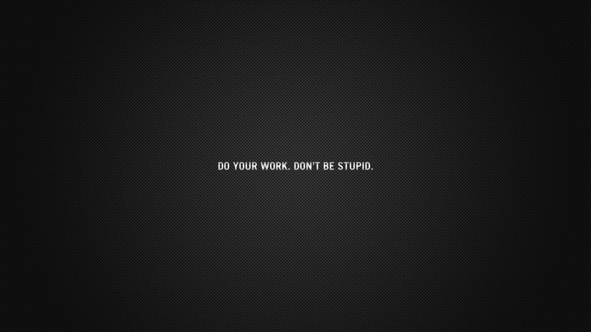 Small white capitals reading DO YOUR WORK, DON'T BE STUPID sit dead centre on a lightly textured grey-black wall.