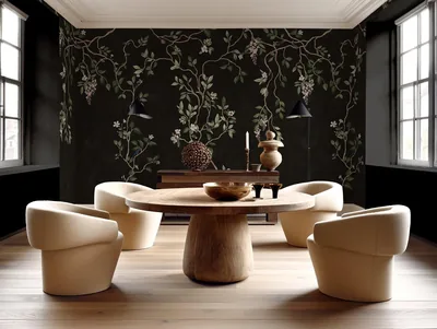 Delicate vines and blossoms trail across black chinoiserie walls behind a round oak table ringed by four cream tub chairs.
