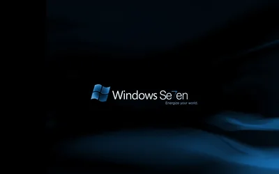 The Windows logo and name sit at the centre of a dark blue field with soft light streaks curling behind.