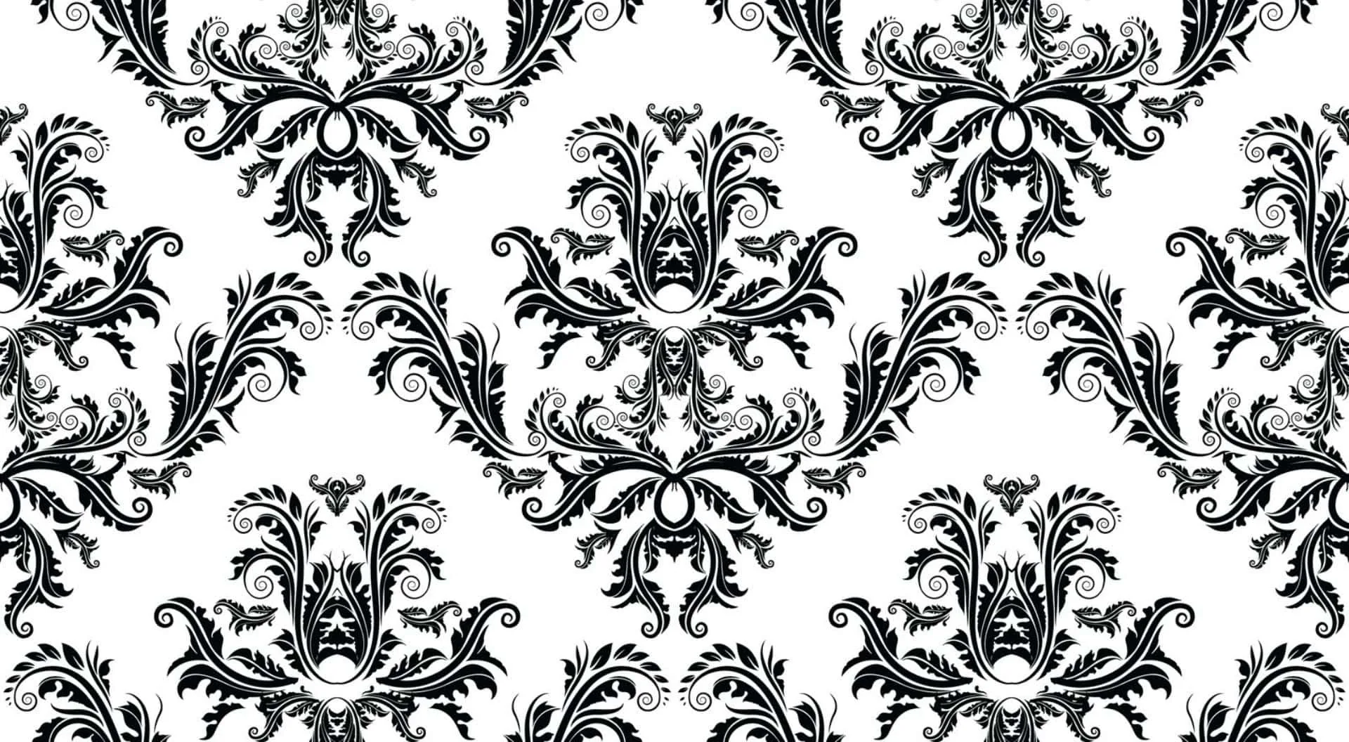 Heavy black acanthus scrolls repeat across clean white in a baroque damask tile, each motif mirrored so the seams disappear.
