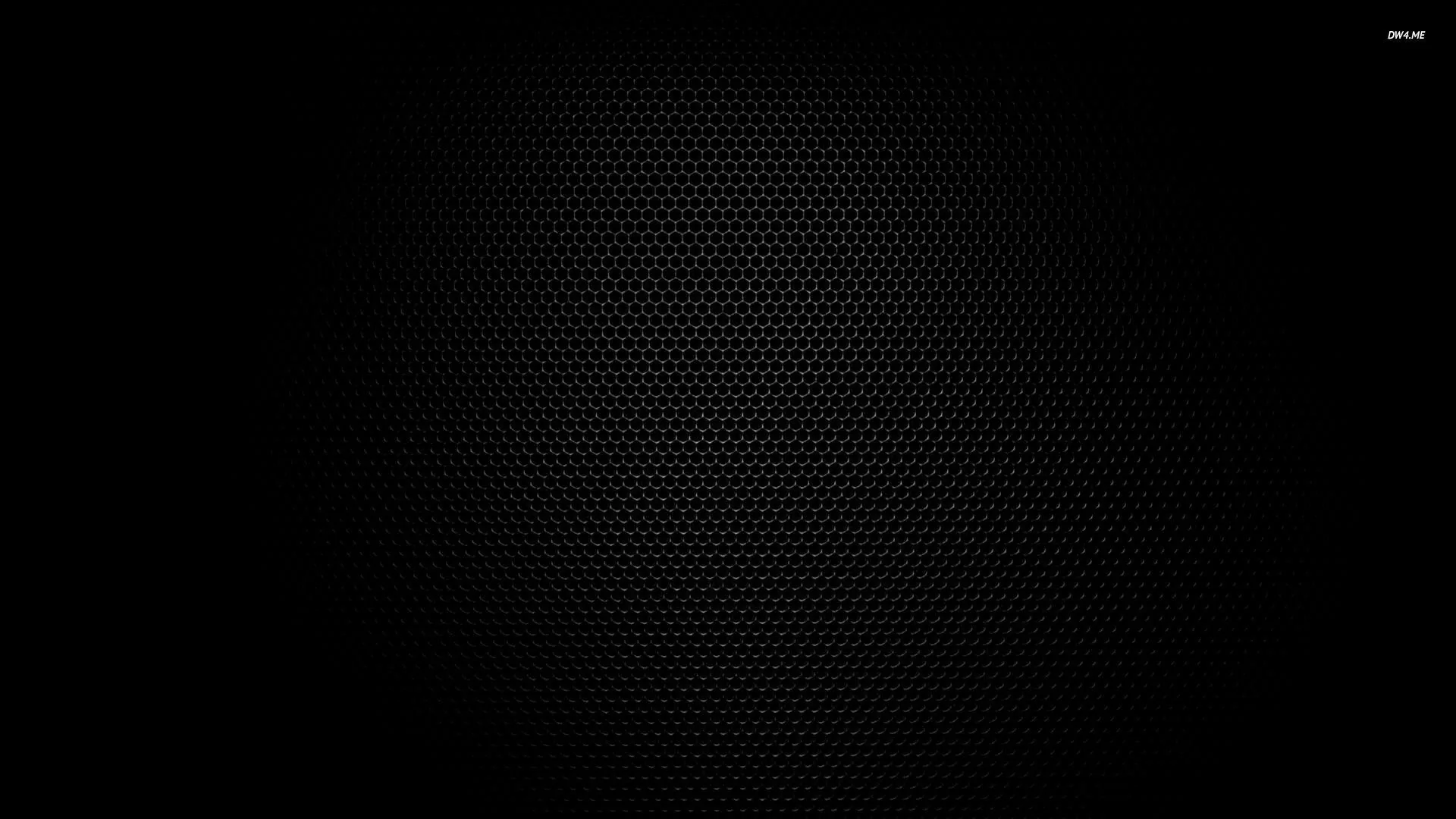 A very fine honeycomb grid covers a dark panel, faintly lit through the centre and sinking into black at every edge.