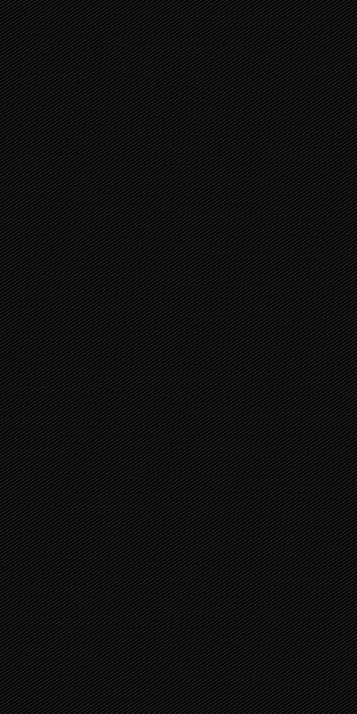 A near-solid black surface with a faint weave visible only where the light catches — deep enough for OLED screens.