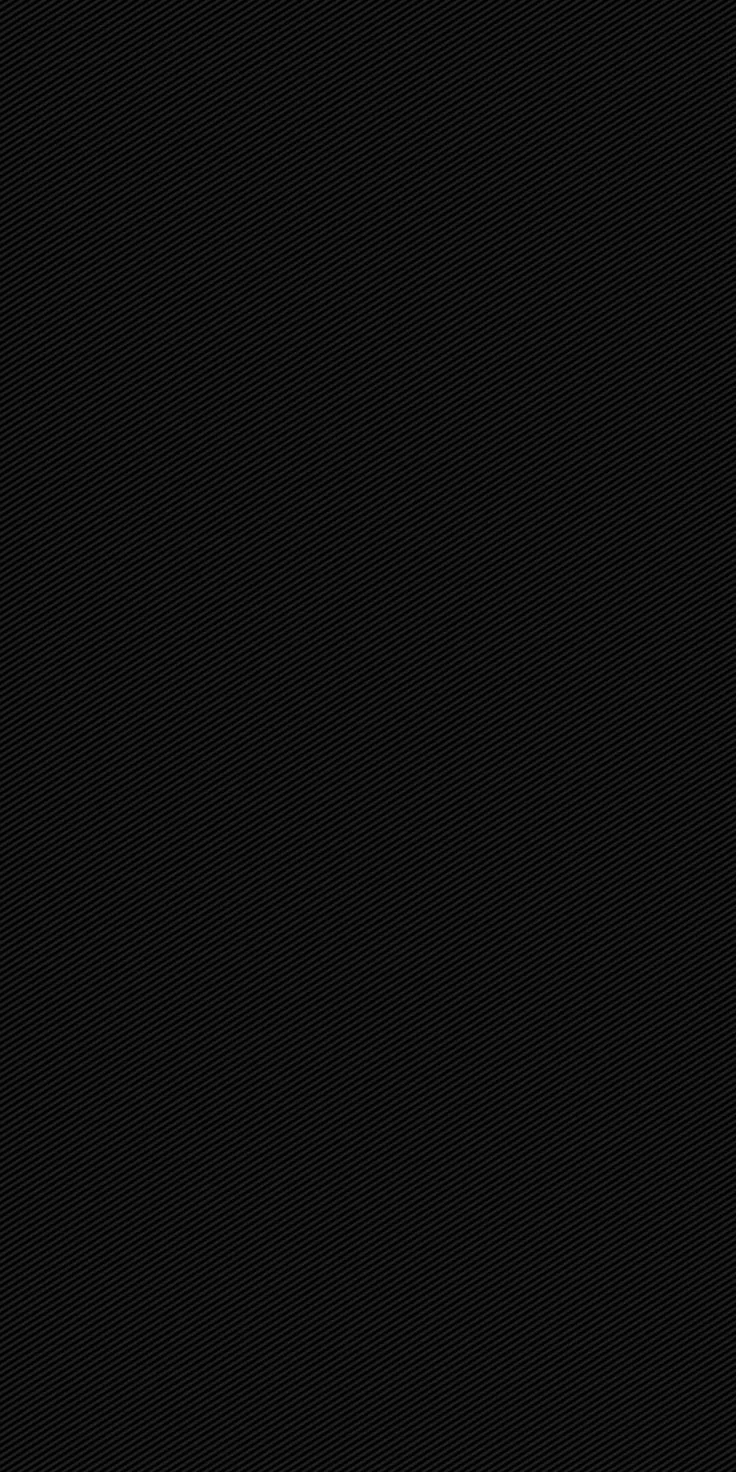 A near-solid black surface with a faint weave visible only where the light catches — deep enough for OLED screens.