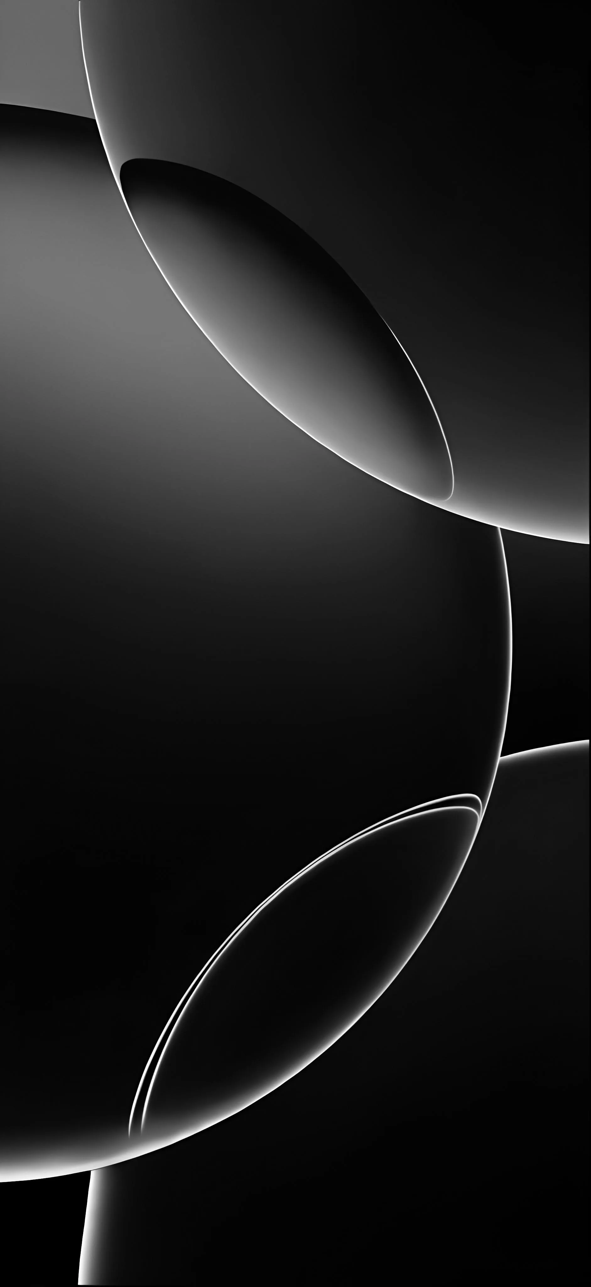 Two large glossy spheres cross in a tall frame, thin white rims tracing where their edges meet against the black.