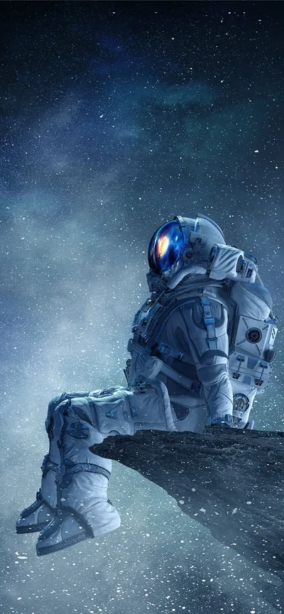 An astronaut sits on a rocky outcrop looking up at a grey-blue starry sky, the figure kept low so the top third stays clear for a clock.
