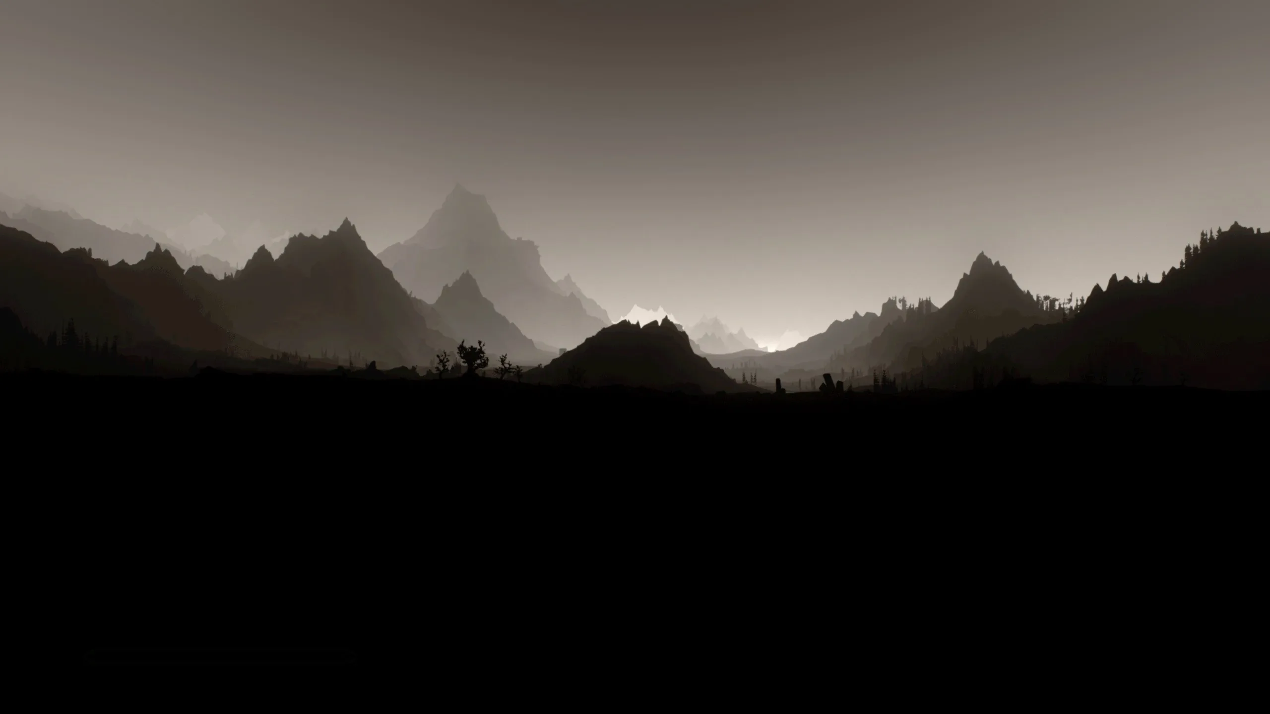 Jagged peaks fade back through brown haze in three tones, with a pitch-dark foreground ridge running along the bottom of the frame.