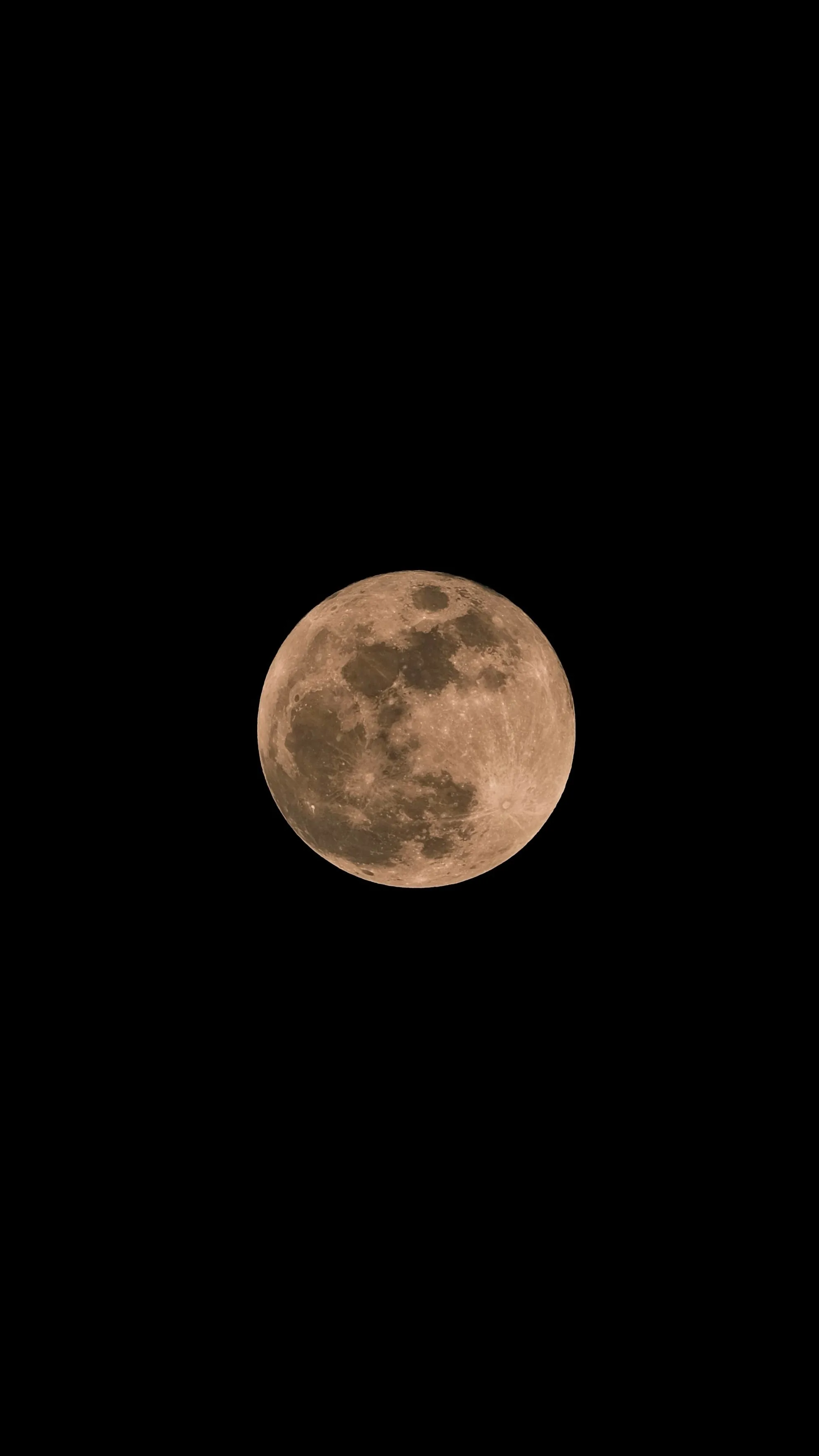 A warm orange moon sits alone against true black, small in the frame so most of the screen stays fully dark on OLED.