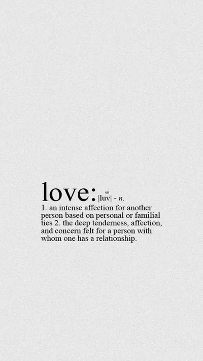 The dictionary entry for love printed in black serif on off-white, set low in the frame with plenty of clear space above it.