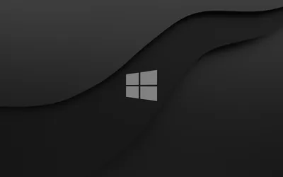The white Windows logo sits left of centre on a charcoal background cut by two smooth wave-shaped bands of slightly different tone.