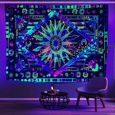 A sun-and-moon mandala tapestry glows teal and green under a purple LED strip, with a chair and round coffee table sitting in the lower-right of the room.