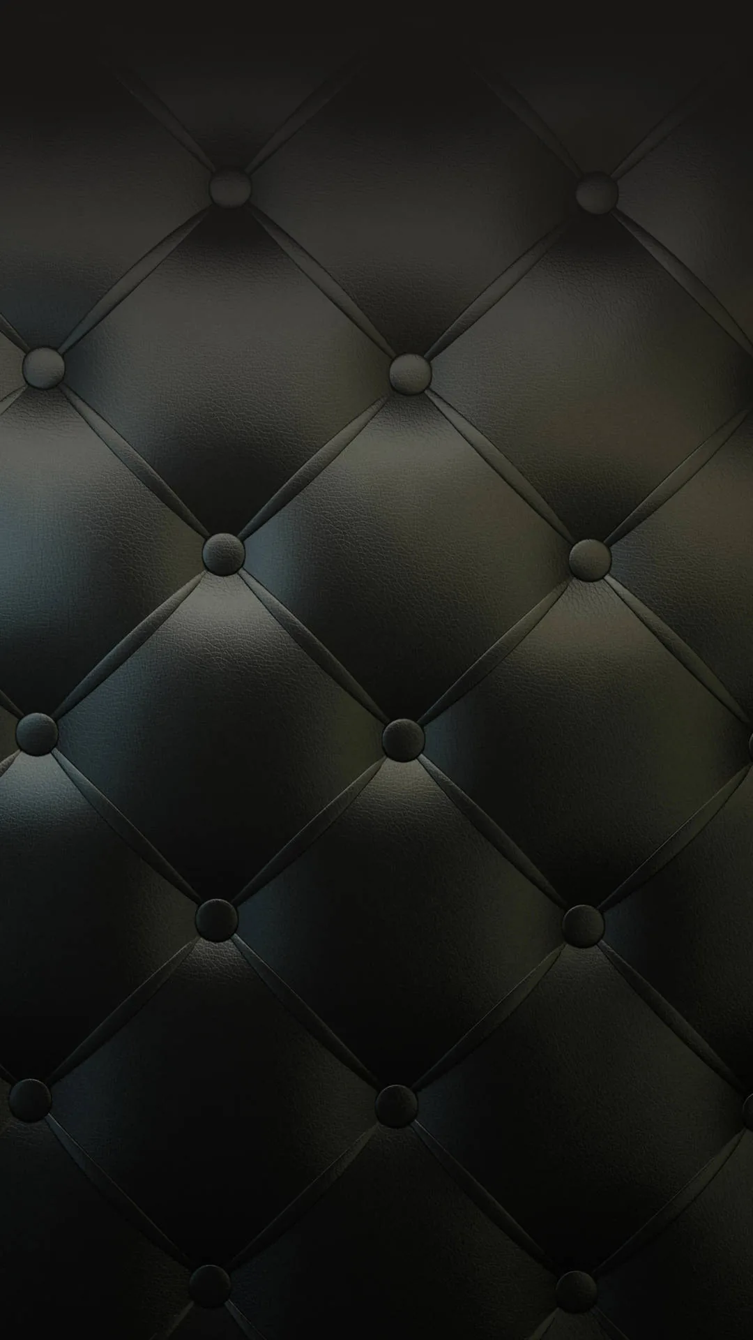 Buttoned tufting pulls dark leather into a diamond grid, a faint blue-green sheen catching along the upper folds.