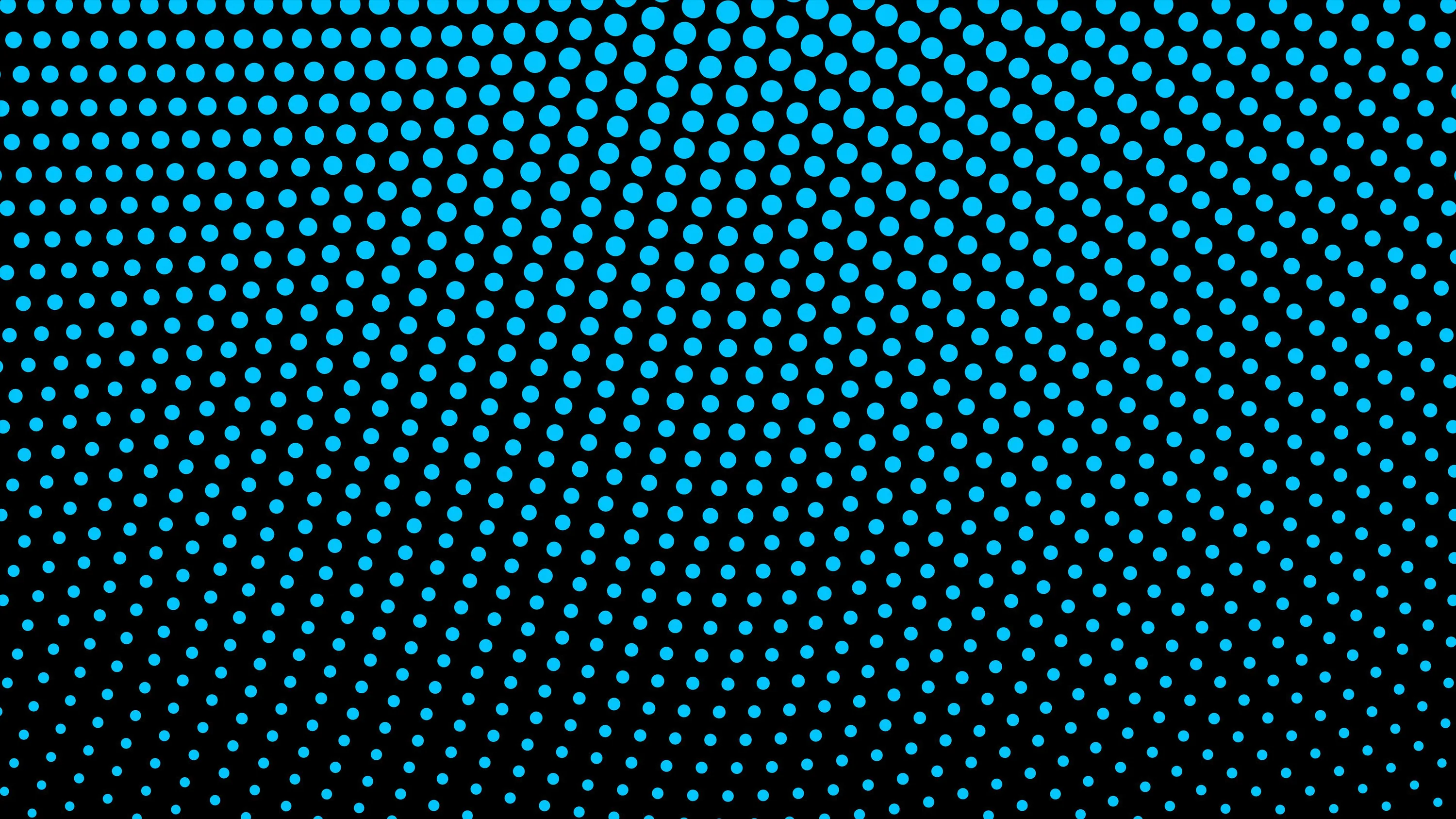 Rows of cyan dots bend in a wide arc from the upper left, shrinking and fading out as they approach the bottom right.