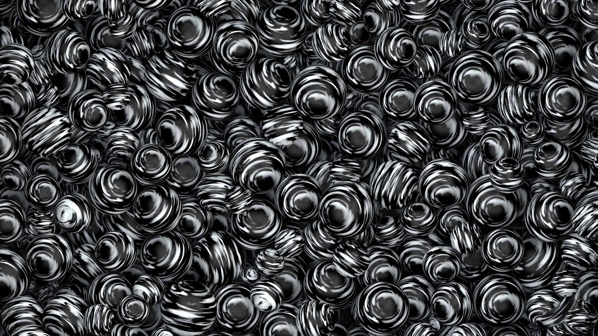 Hundreds of polished coiled forms pile on top of each other, each catching a bright highlight so the surface reads as liquid metal.